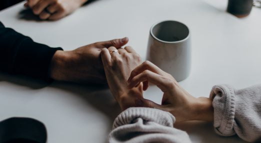 two people holding hands