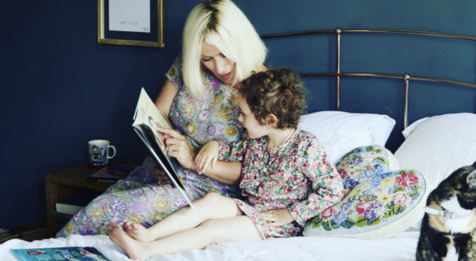 Mother reading to her daughter