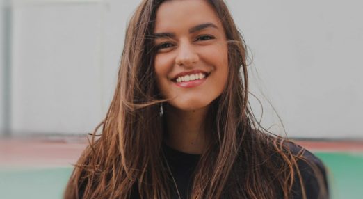 young woman smiling to camera