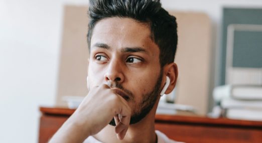 man looking into the distance thoughtfully