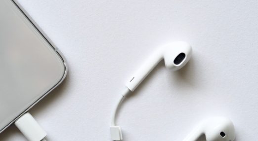 white headphones on a table