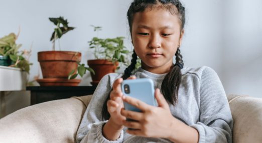 young girl on mobile phone