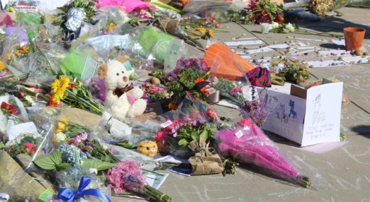 flowers and teddy bears left in memory