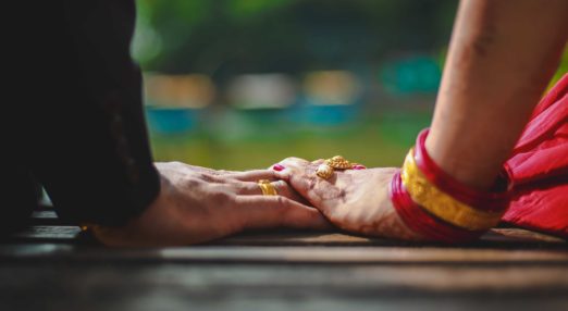 Holding hands on a bench