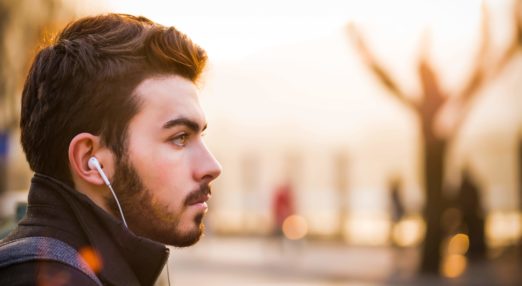 Man listens on headphones